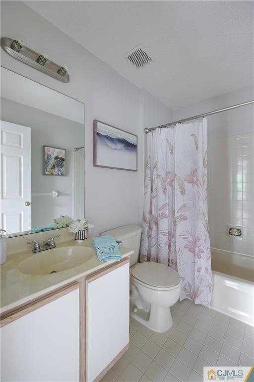 53 Prestwick Way Edison, NJ 08820 - Photo 20 of 28 a bathroom with a sink toilet and shower