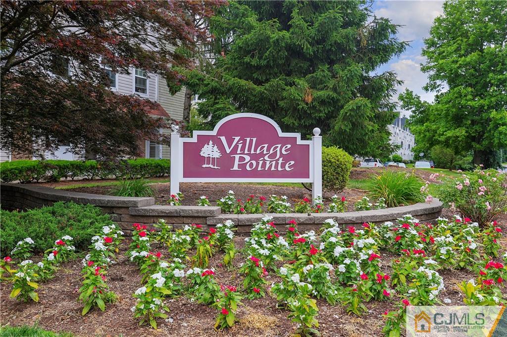 53 Prestwick Way Edison, NJ 08820 - Photo 21 of 28 a sign that is on the side of the road