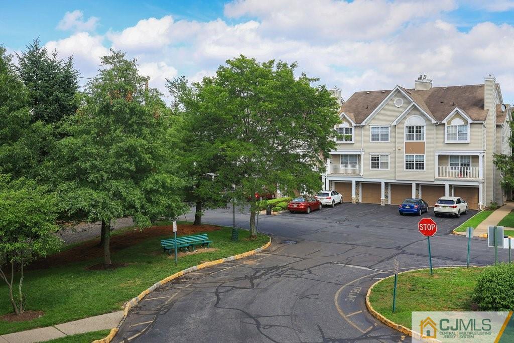 53 Prestwick Way Edison, NJ 08820 - Photo 22 of 28 a front view of a house with a garden and yard