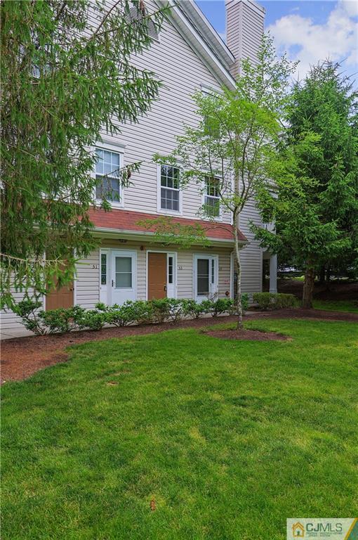 53 Prestwick Way Edison, NJ 08820 - Photo 4 of 28 a front view of a house with a garden