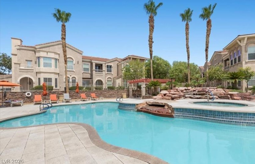 10550 West Alexander Road, Unit 2177 Las Vegas, NV 89129 - Photo 18 of 19 Relax poolside and enjoy the beautiful desert landscape surrounding this community oasis.