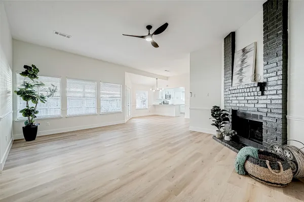 a view of a livingroom with furniture a fireplace