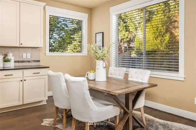 a view of a dining room with furniture and window