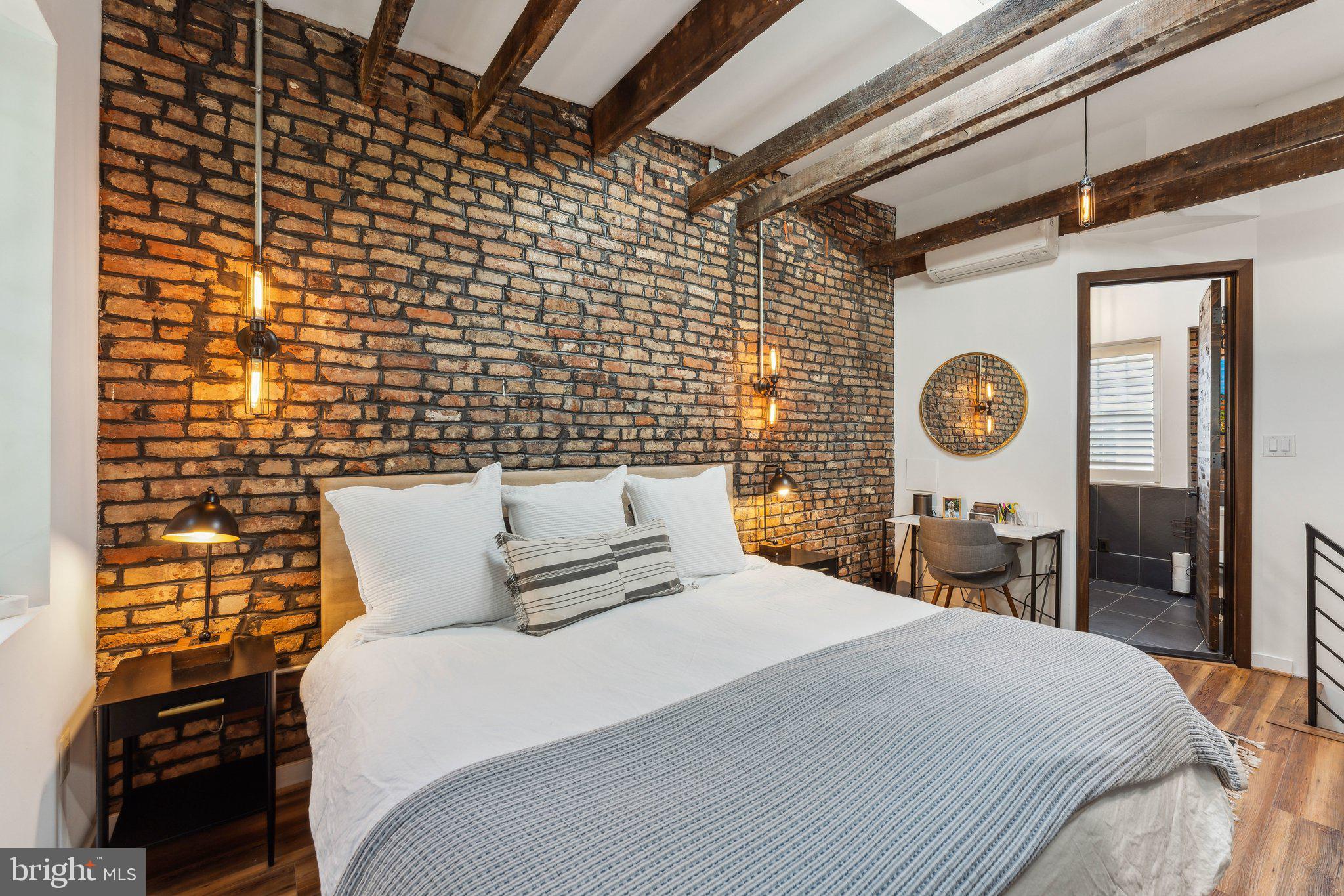 7 Pomander Walk Northwest Washington, DC 20007 - Photo 11 of 23 a bedroom with a bed and a lamp next to a window