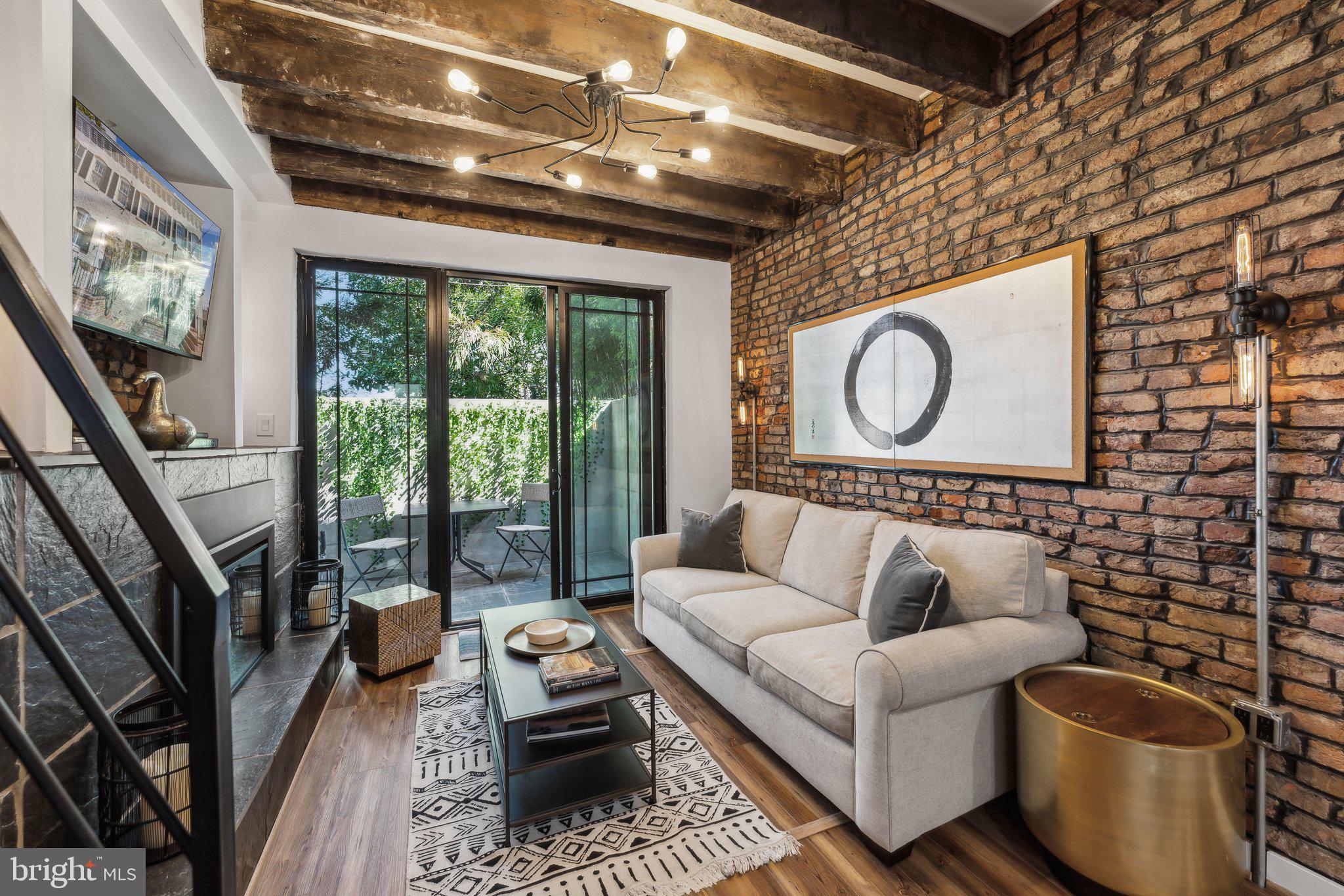 7 Pomander Walk Northwest Washington, DC 20007 - Photo 4 of 23 a living room with furniture a rug and a large window