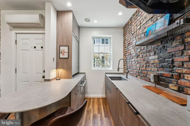 a kitchen with stainless steel appliances granite countertop a sink and cabinets