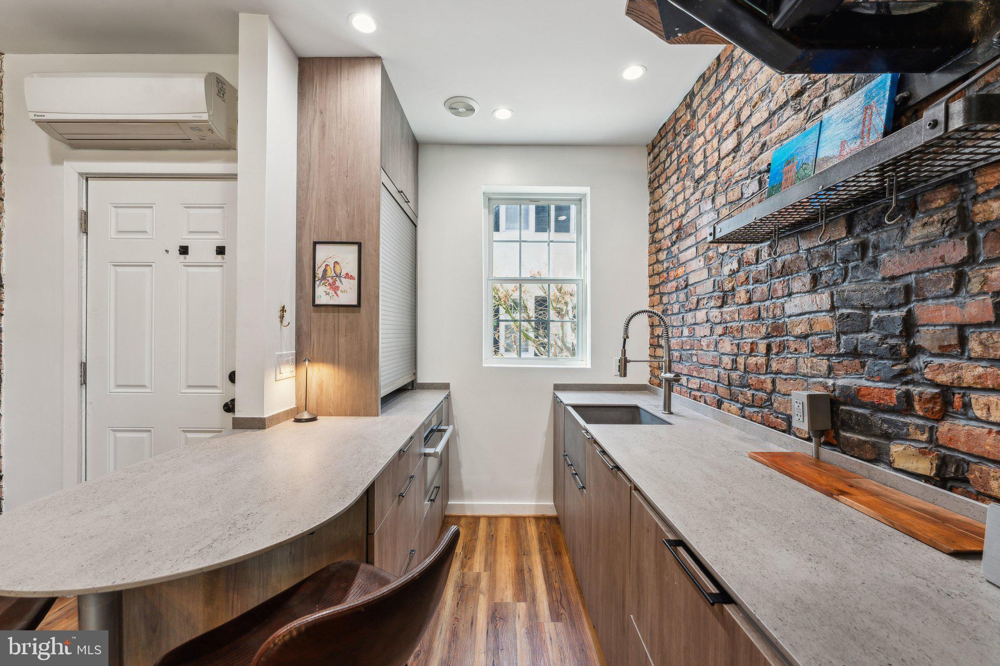 7 Pomander Walk Northwest Washington, DC 20007 - Photo 7 of 23 a kitchen with stainless steel appliances granite countertop a sink and cabinets