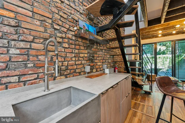 a view of a kitchen with furniture and a window