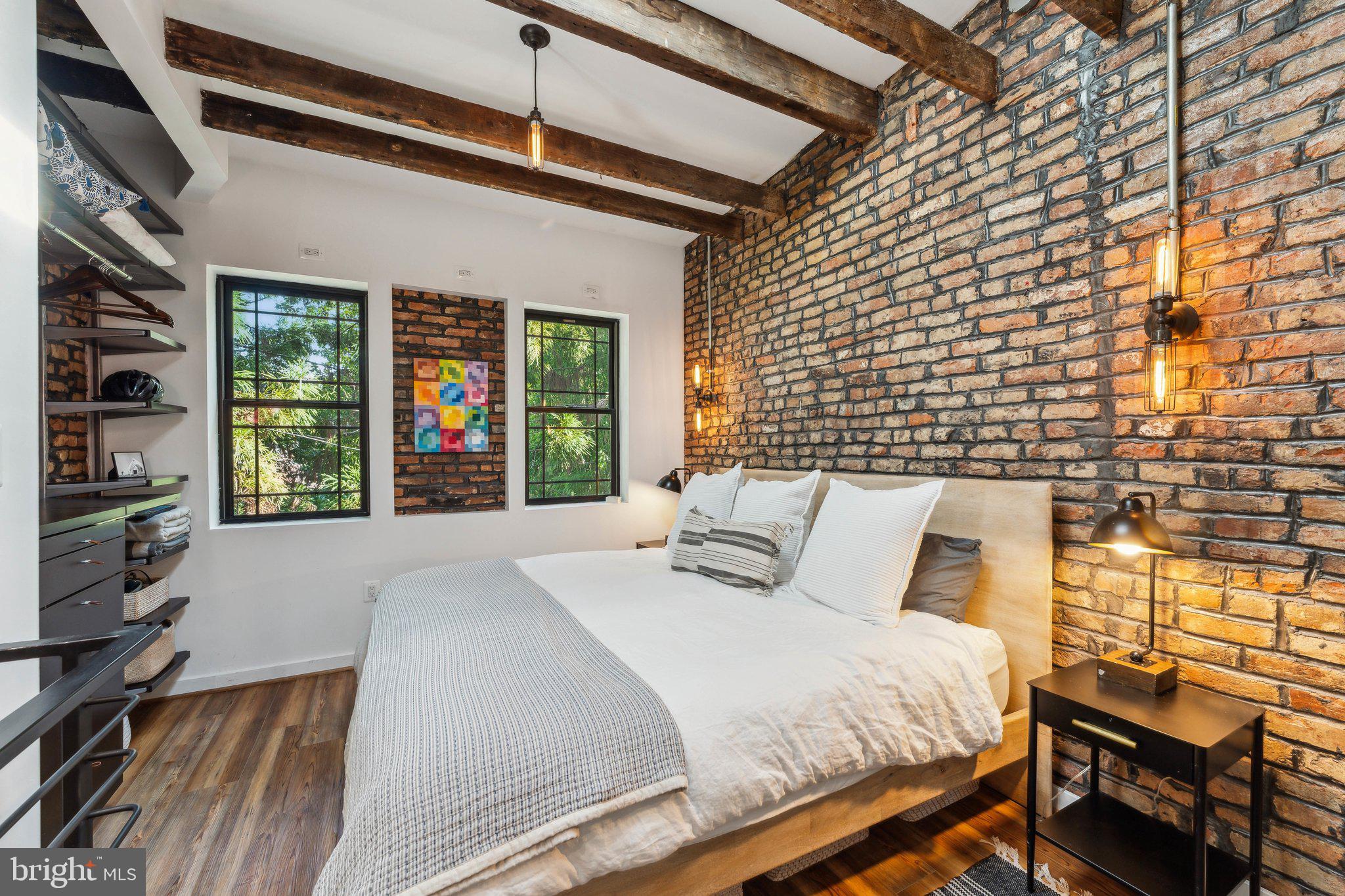 7 Pomander Walk Northwest Washington, DC 20007 - Photo 10 of 23 a bedroom with a bed and a flat tv screen