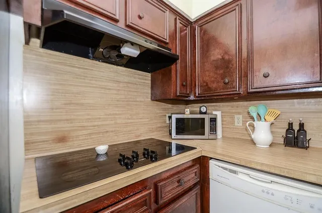 a bedroom with a bed and a television