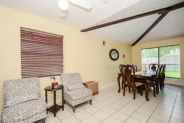 a bed room with a bed and a chandelier