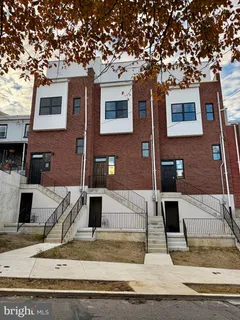 a front view of a house with garage