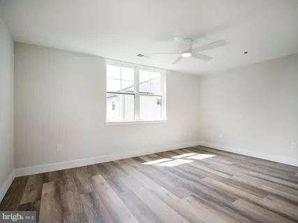 a bathroom with a toilet and a bathtub
