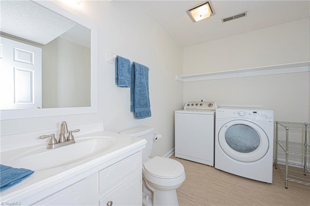 128 Westridge Road Advance, NC 27006 - Photo 24 of 30 Laundry room and half bathroom in the lower level