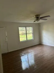 an empty room with a empty space and windows