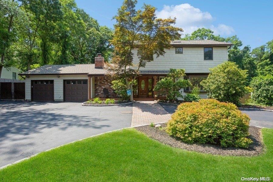 134 Rocky Point Landing Road Rocky Point, NY 11778 - Photo 1 of 1 a front view of a house with a garden
