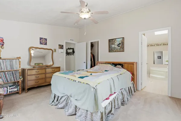a bedroom with a bed and furniture