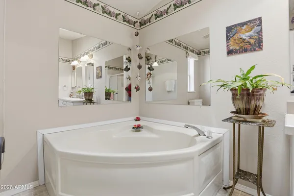 a white bath tub sitting next to a white sink