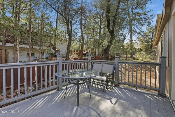 a view of a chair and table on the wooden floor