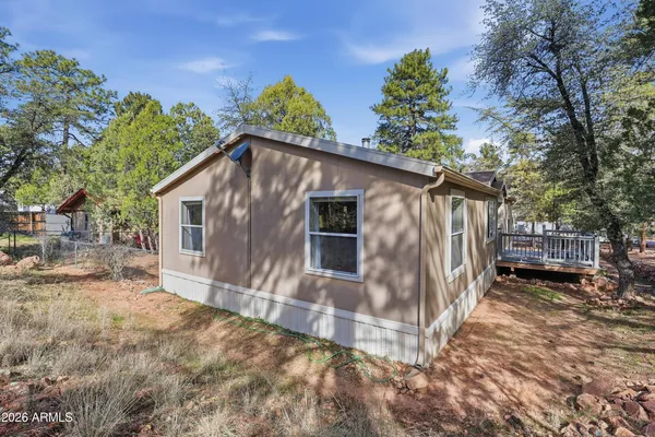a view of a house with a tree