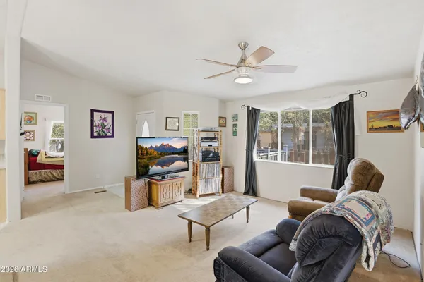 a living room with furniture and a window