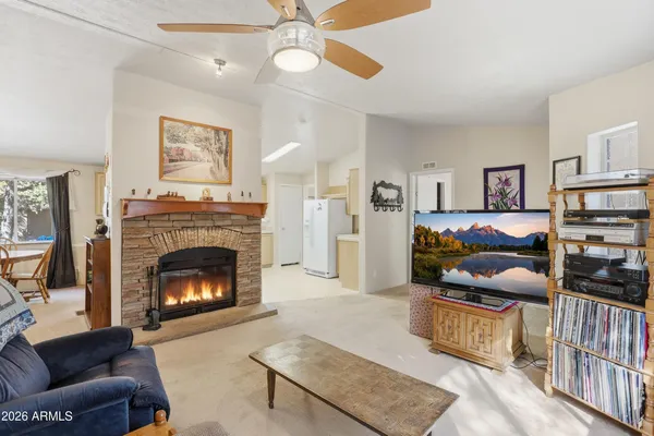 a bedroom with furniture and a fireplace
