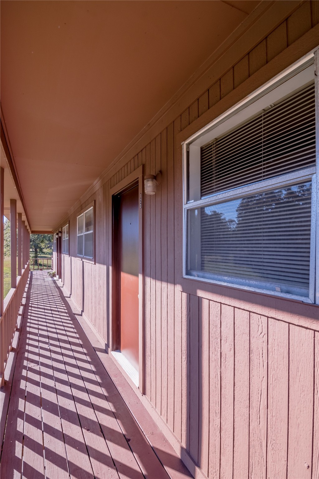 120 McAdams Lane, Unit F Huntsville, TX 77320 - Photo 17 of 21 a view of wooden balcony