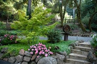 450 Summit Spring Road Woodside, CA 94062 - Photo 8 of 19 a front view of a house with a yard and fountain