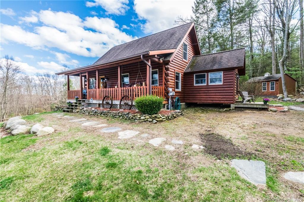 115 West Granby Road Granby, CT 06035 - Photo 1 of 1 a front view of a house with garden