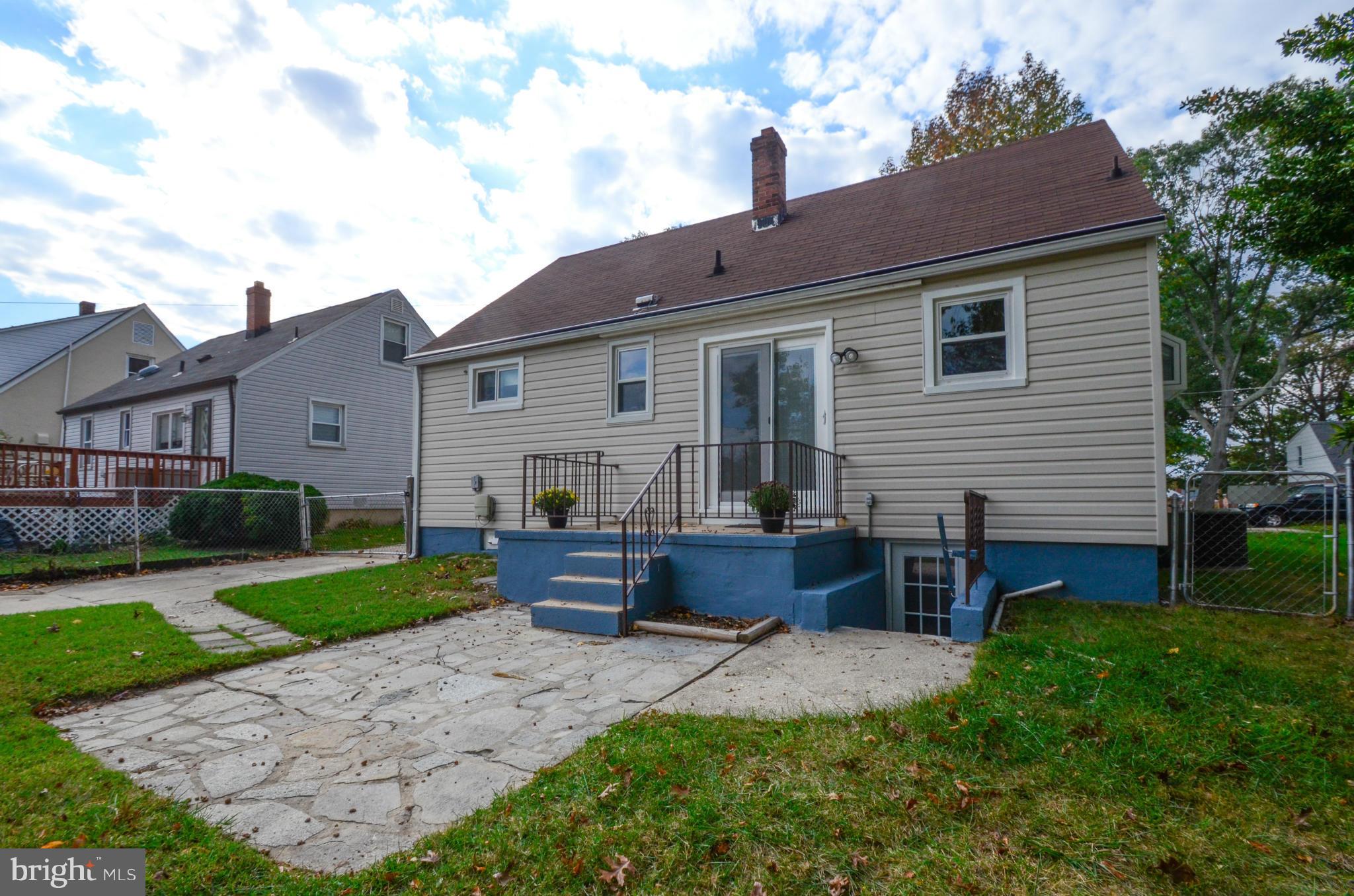 8107 Hillendale Road Baltimore, MD 21234 - Photo 29 of 30 a front view of house with yard and outdoor seating