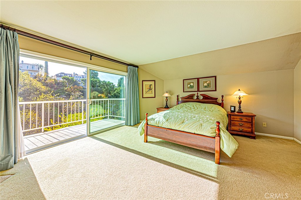 22138 Rim Fire Lane Diamond Bar, CA 91765 - Photo 21 of 61 a bedroom with a bed and a large window with outer view