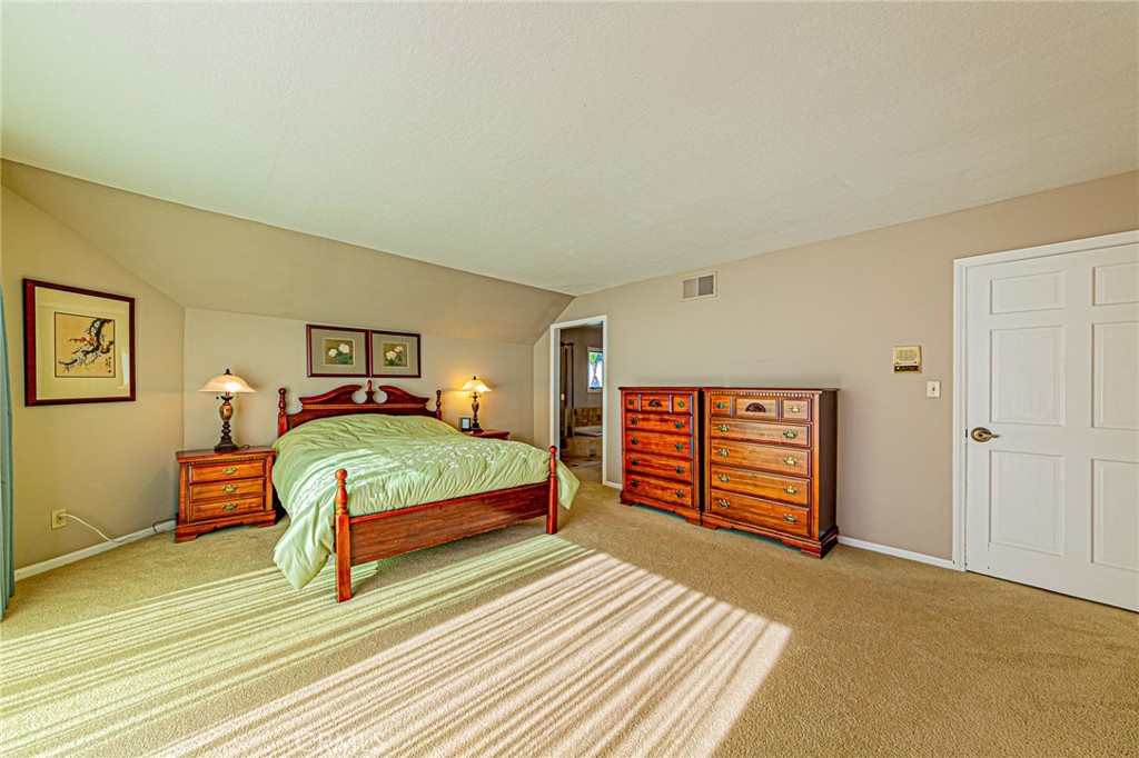 22138 Rim Fire Lane Diamond Bar, CA 91765 - Photo 23 of 61 a bedroom with a bed and a cabinets