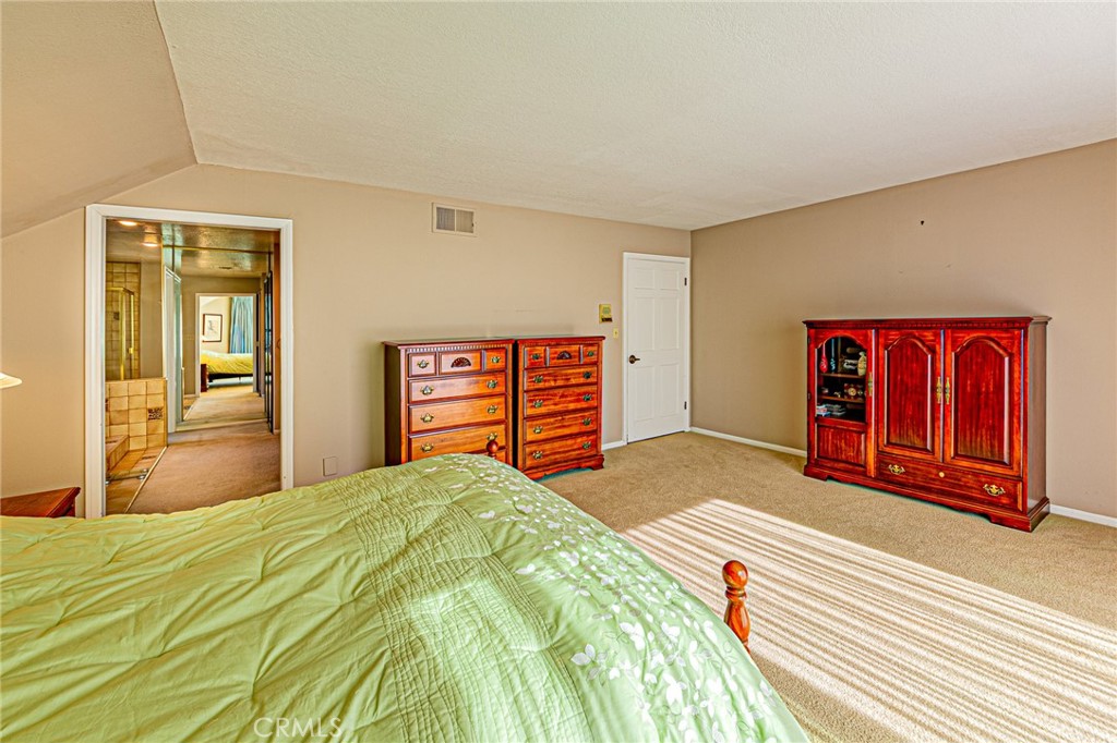 22138 Rim Fire Lane Diamond Bar, CA 91765 - Photo 25 of 61 a bedroom with a bed and a dresser