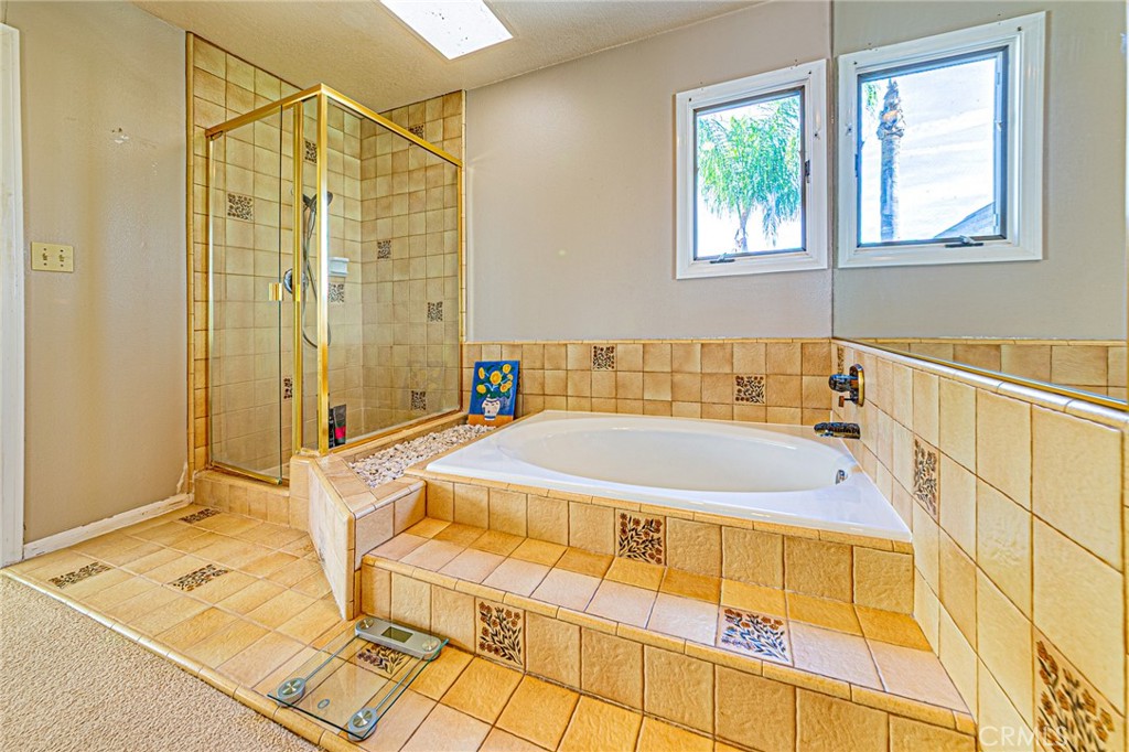 22138 Rim Fire Lane Diamond Bar, CA 91765 - Photo 27 of 61 a bathroom with a bathtub and shower