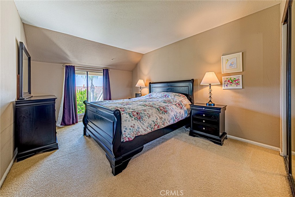 22138 Rim Fire Lane Diamond Bar, CA 91765 - Photo 31 of 61 a bedroom with a bed and a closet