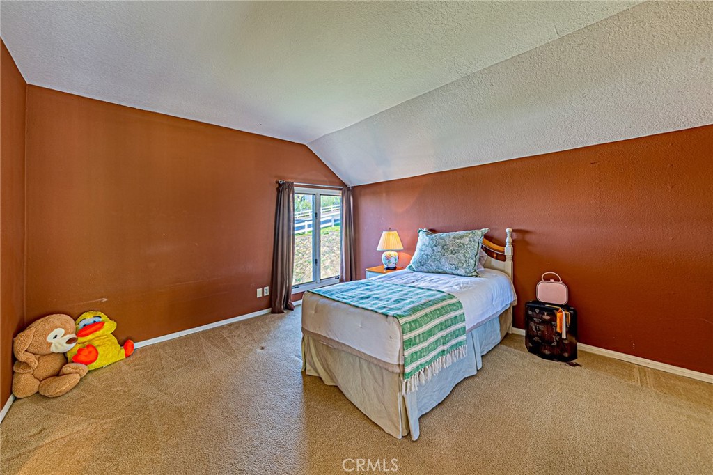 22138 Rim Fire Lane Diamond Bar, CA 91765 - Photo 35 of 61 a bedroom with a bed and window