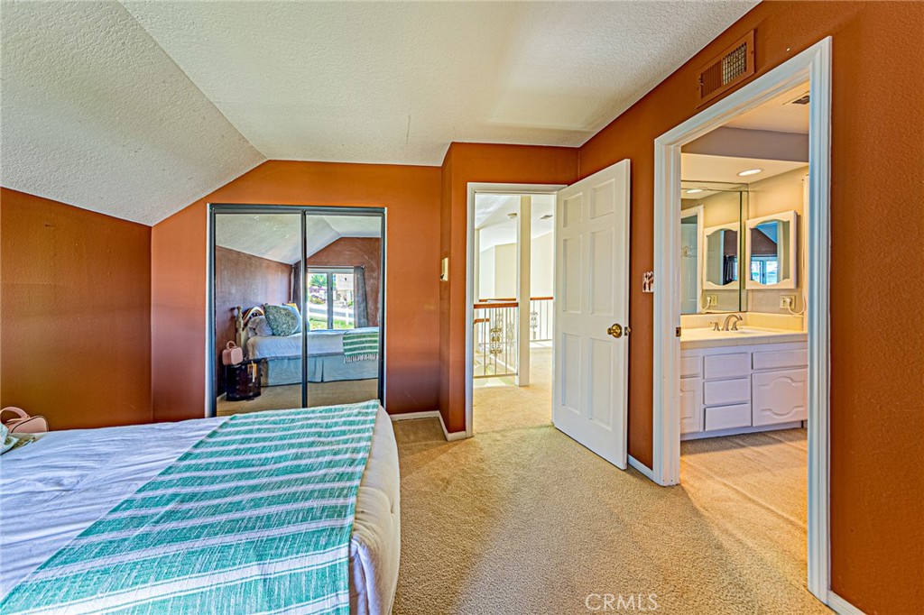 22138 Rim Fire Lane Diamond Bar, CA 91765 - Photo 36 of 61 a bedroom with a bed and a dresser