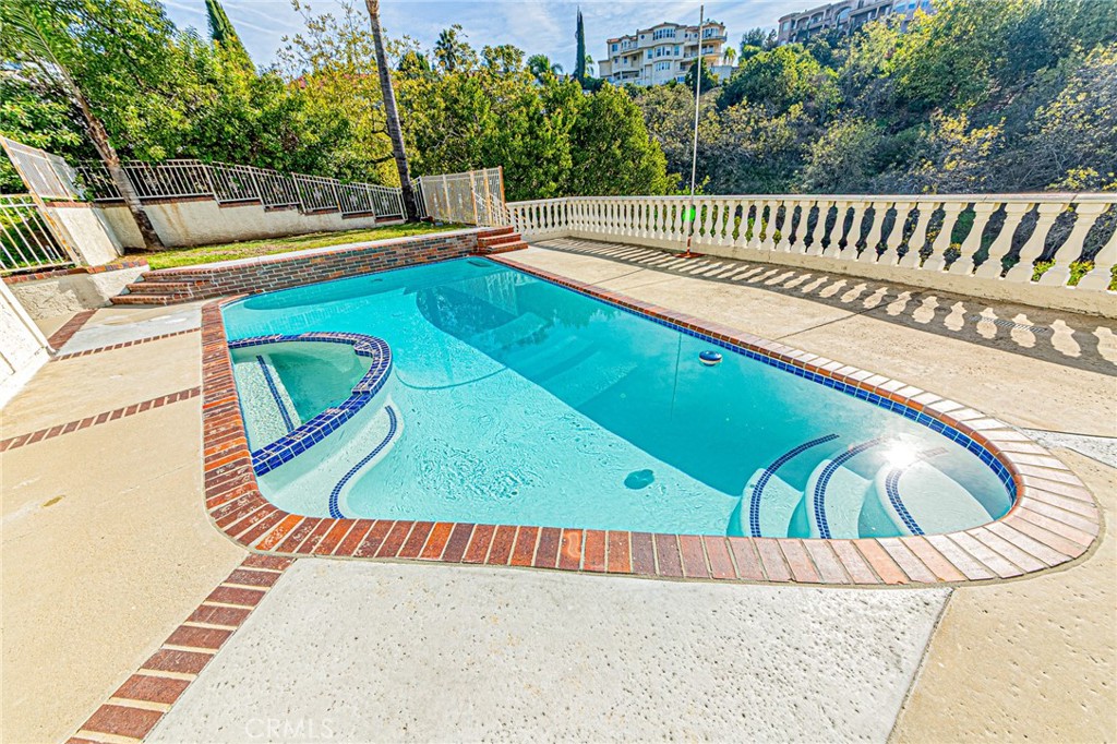 22138 Rim Fire Lane Diamond Bar, CA 91765 - Photo 51 of 61 a view of a swimming pool with a lounge chair