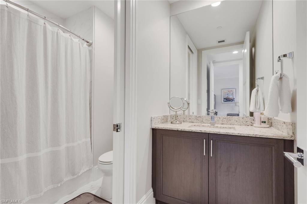 1135 3rd Avenue South, Unit 403 Naples, FL 34102 - Photo 17 of 34 Full bathroom featuring vanity, shower / bath combo with shower curtain, and recessed lighting