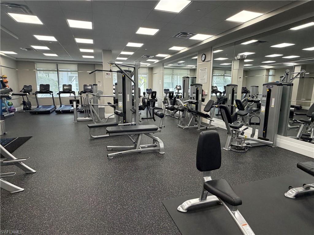 1135 3rd Avenue South, Unit 403 Naples, FL 34102 - Photo 30 of 34 Workout area featuring a paneled ceiling