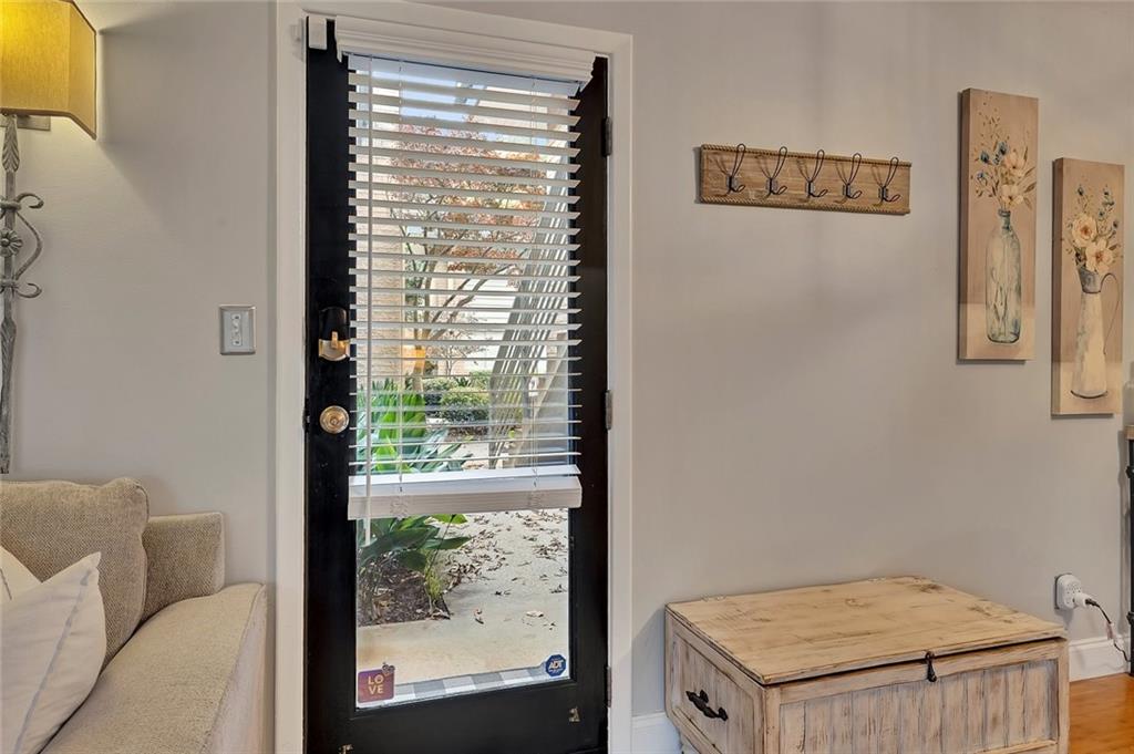 a view of a room that has a window and a kitchen
