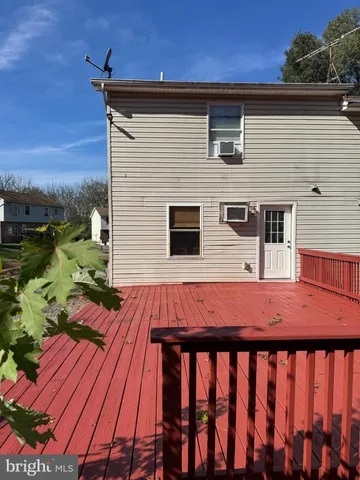 a balcony view with a seating space