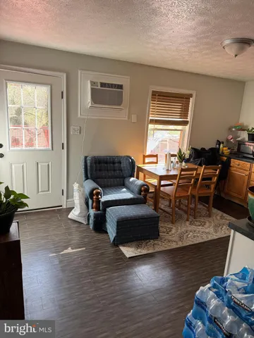 a living room with furniture window and wooden floor