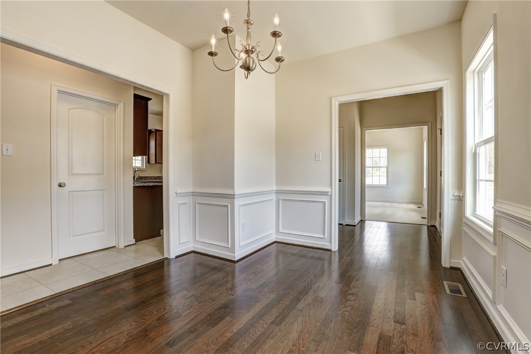 7118 Appelman Road Chesterfield, VA 23832 - Photo 3 of 19 a view of an empty room with wooden floor and a window