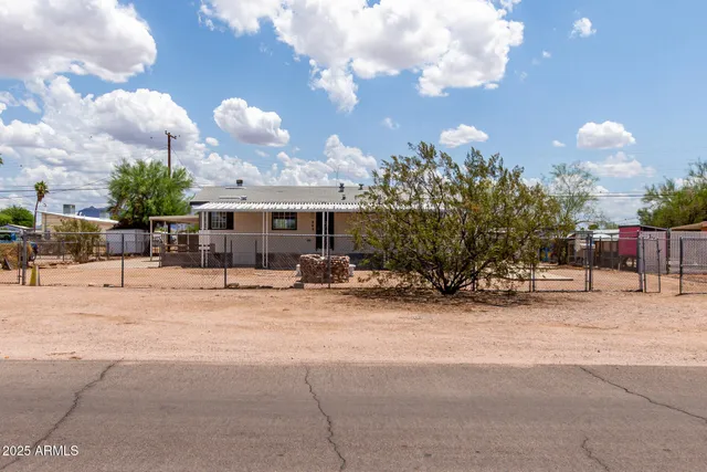 a view of a street with a building in the background
