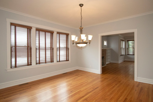 Undisclosed Address Oak Park, IL 60302 - Photo 2 of 18 a view of an empty room with wooden floor and a window