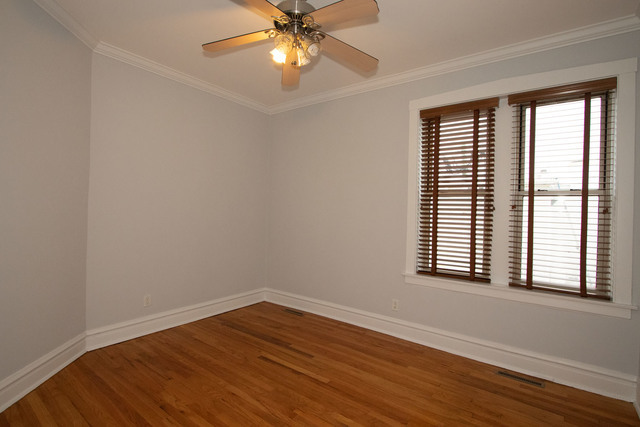 Undisclosed Address Oak Park, IL 60302 - Photo 7 of 18 wooden floor in an empty room with a window