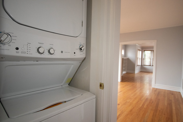 Undisclosed Address Oak Park, IL 60302 - Photo 9 of 18 a view of washer and dryer with wooden floor