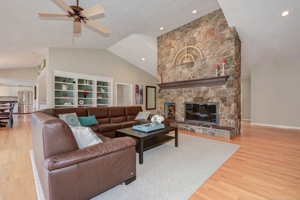 147 Coburn Road Berlin, MA 01503 - Photo 1 of 25 a living room with furniture a fireplace and wooden floor