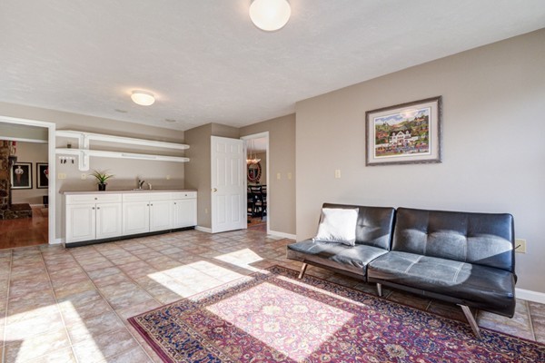 147 Coburn Road Berlin, MA 01503 - Photo 19 of 25 a living room with furniture and white walls